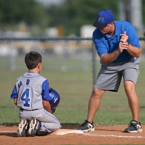 A coach teaching a player